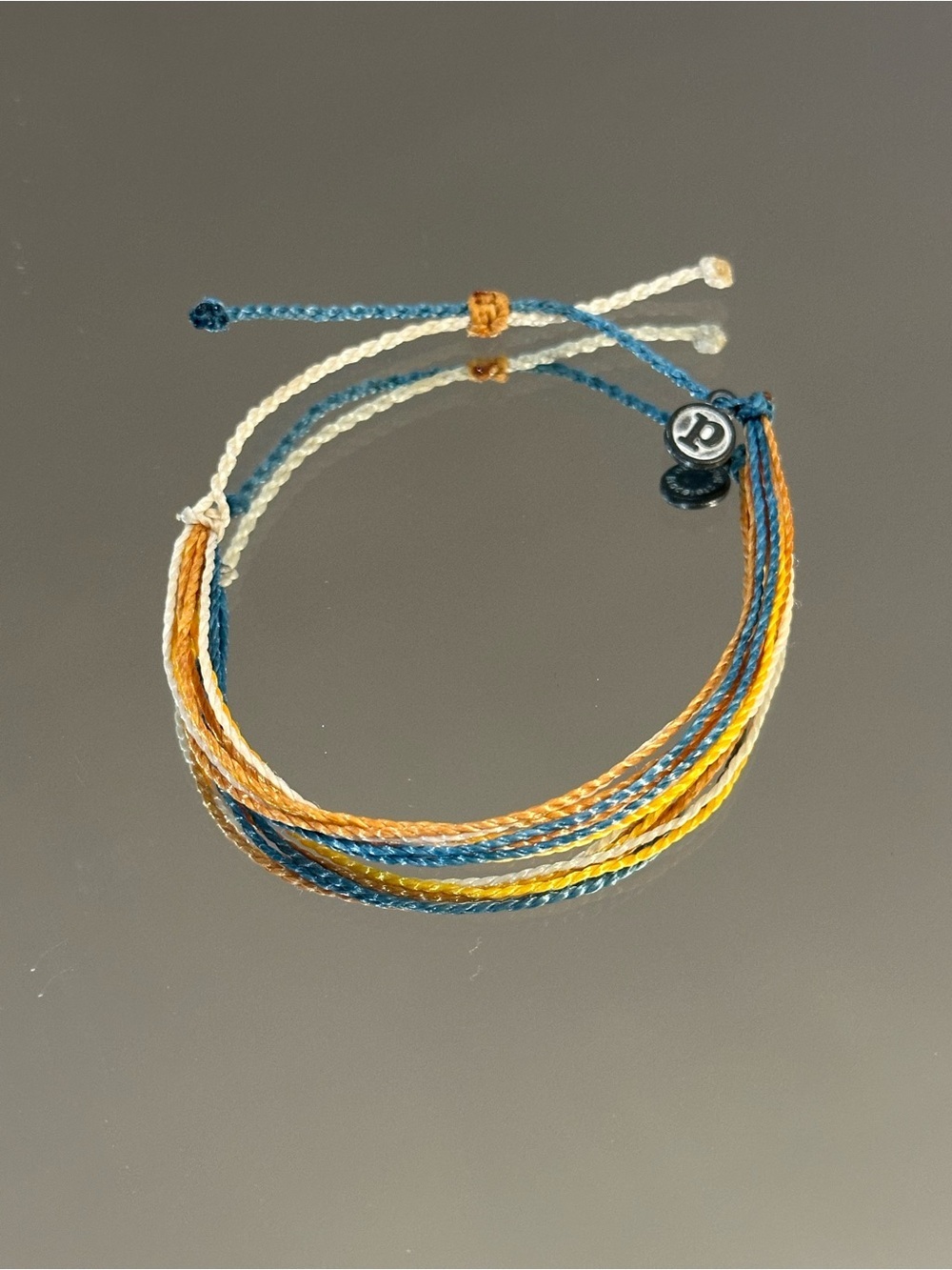 Pura Vida. Multi-strand Blue, Gold, Crean & Yellow Bracelet